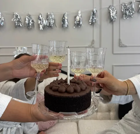 Spa day celebration with chocolate cake and champagne toast