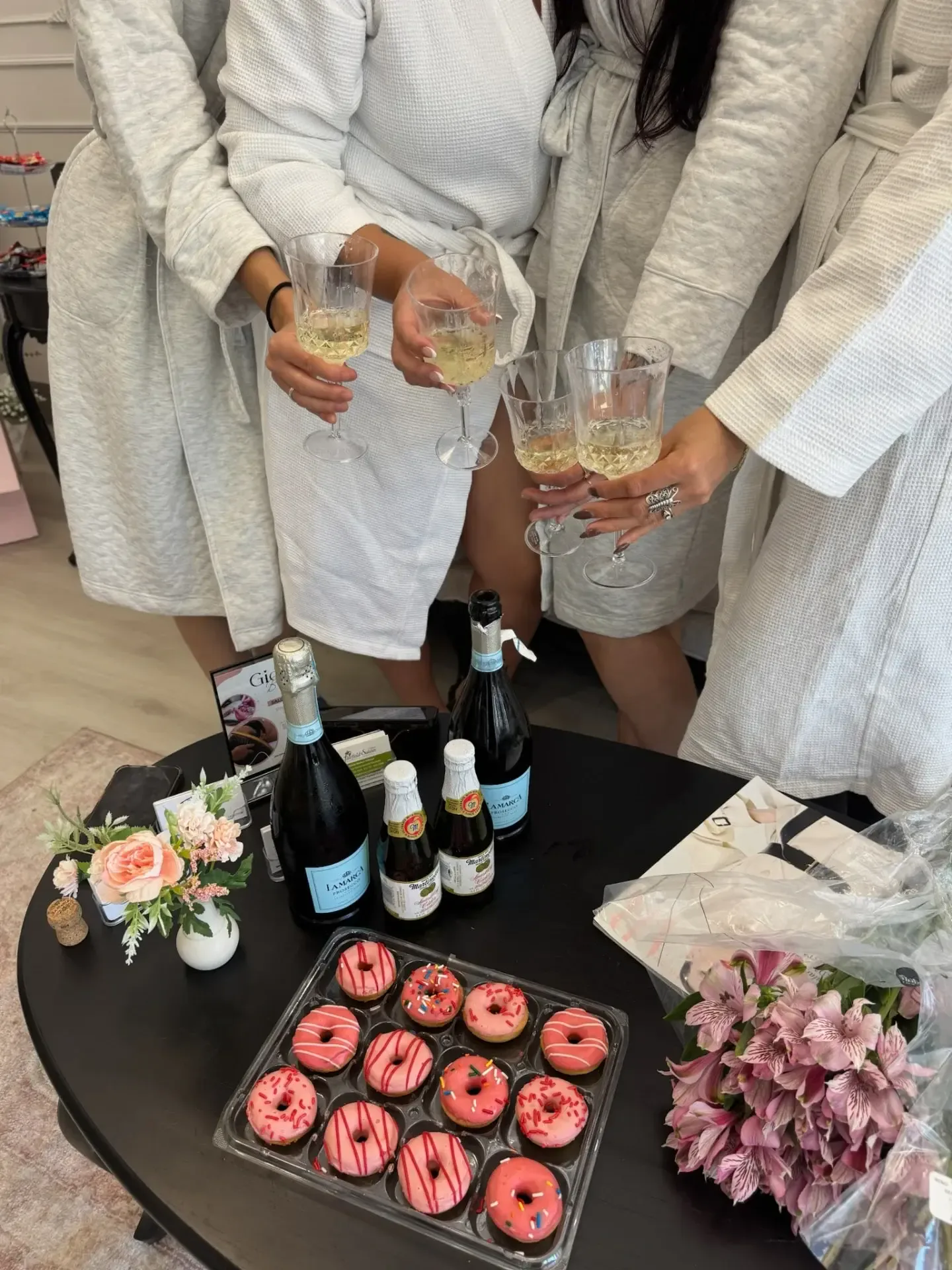 Spa day celebration with champagne and donuts