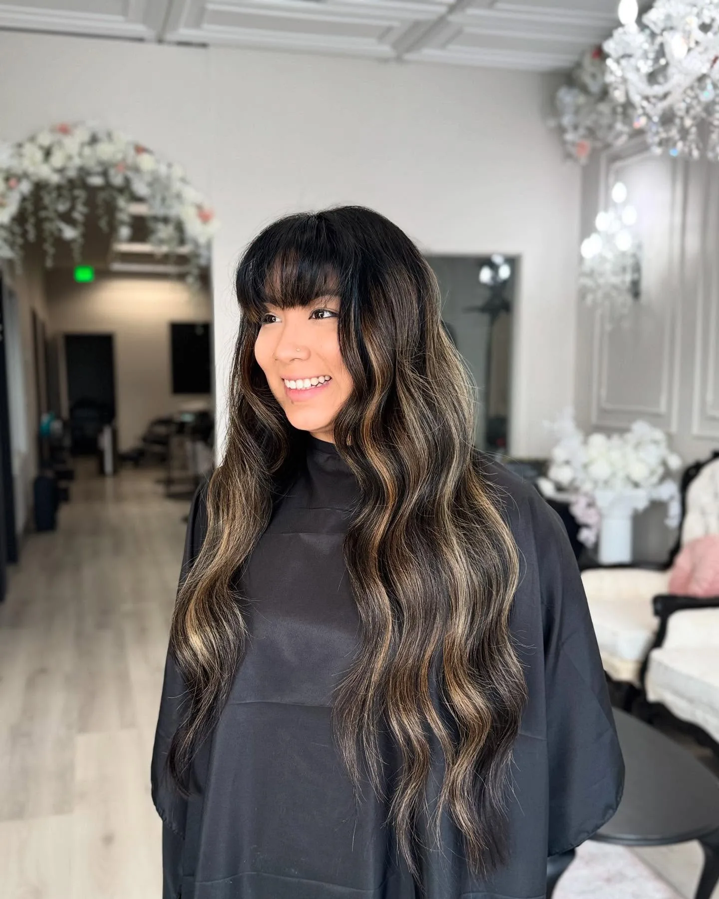 Dark hair with blonde highlights and bangs