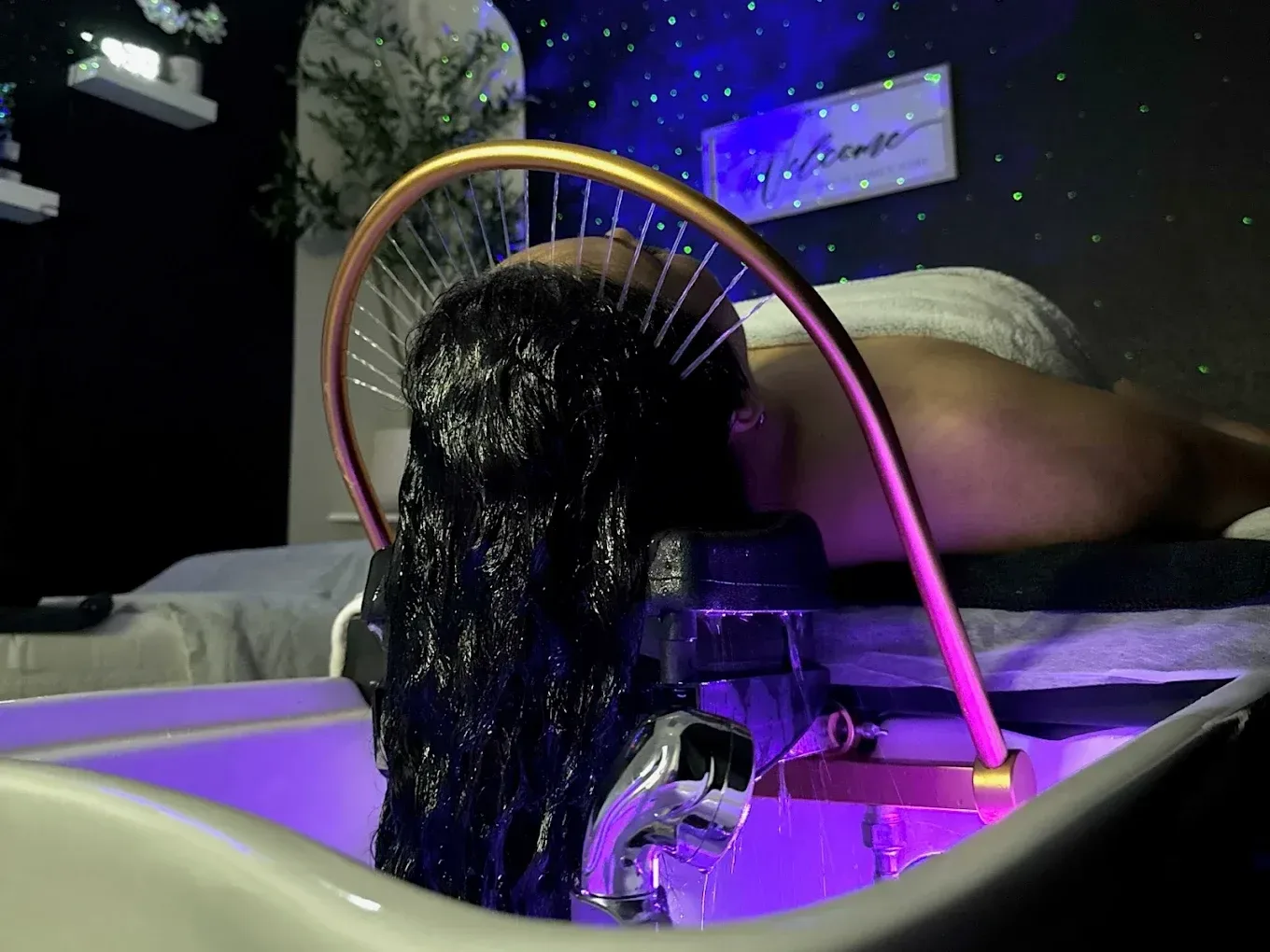 Head spa treatment with water jets and LED lights